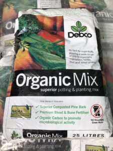 Debco Superior Organic Potting & Planting Mix 25L. Features include superior composted pine bark, premium blood and bone fertiliser, organic carbon, and a 25-liter capacity.
