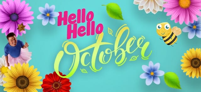 Colorful flowers and a smiling bee surround the text "Hello October in the Garden" on a bright blue background. A person in a fairy costume is on the left, adding magic to this vibrant scene.
