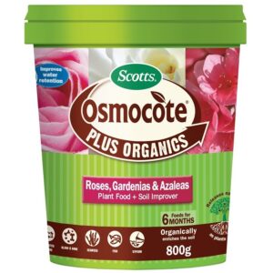 A tub of Osmocote Plus Organics Fertiliser: Roses, Gardenias, Azaleas and Camellias 700g—features label details and flower images; ideal as a specialised fertiliser for roses, gardenias, azaleas, and camellias.