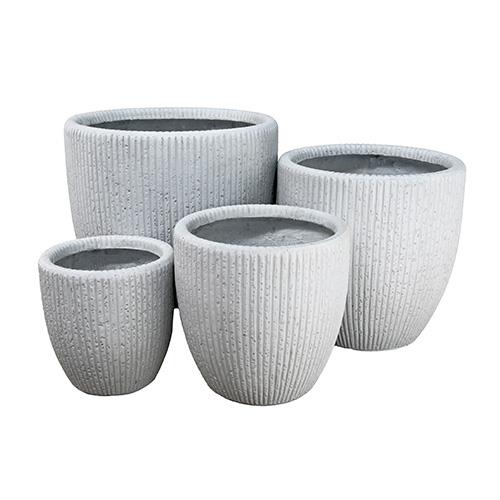A set of four grey GardenLite Fluted Cone White XS (24x26) pots on a white background.
