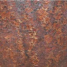 Close-up of a rusted metal surface, showing a rough texture with varying shades of brown, orange, and dark spots.