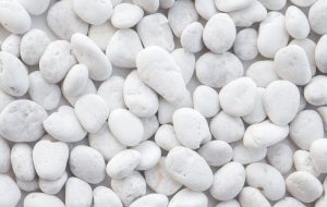 Pebbles Snow White 10-30mm 20kg Bag features smoothly polished pebbles in varying sizes, closely arranged for a refined look.