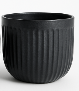 A matt black ceramic planter with vertical ridges, shown empty against a plain background.