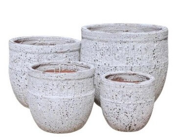 A Sorrento Torino Ancient Egg White Seafoam S plant pot measuring 28x28cm adds an elegant, antique-inspired touch to your décor with its textured white finish.