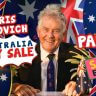 Smiling man in a suit sits at a desk with Australian flags and sale signs; text reads "Chris Kekovich Australia Day Flash Sale - Part 2 Sale Ended.