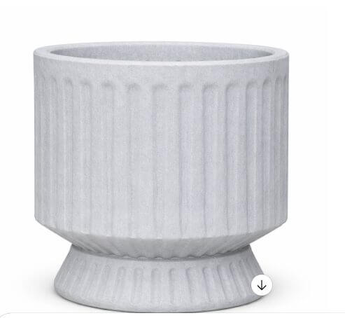 A white, round planter with vertical ridges and a flared base, displayed against a plain background.